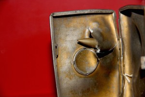 bullet lodged in cigarrette case