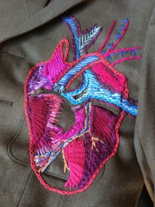anatomical embroidery of a heart on an army jacket