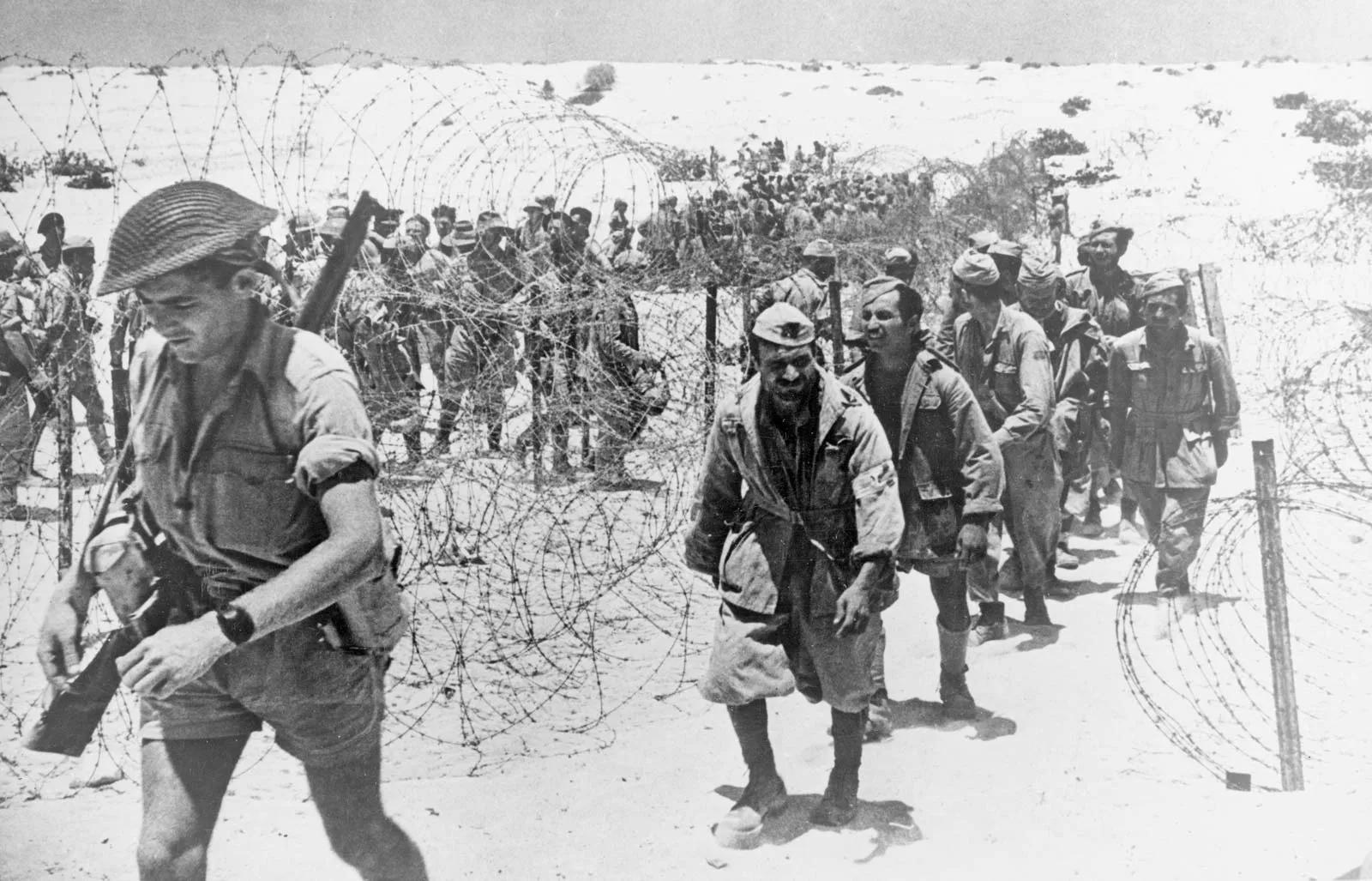 Italian prisoners of war being led into a barbed-wire enclosure after the Second Battle of El-Alamein November 1942 - courtesy of Britannica
