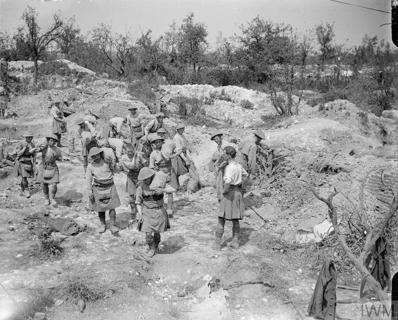IWM Q4085 Scottish troops collecting bricks in the ruins of Montauban for road repairs